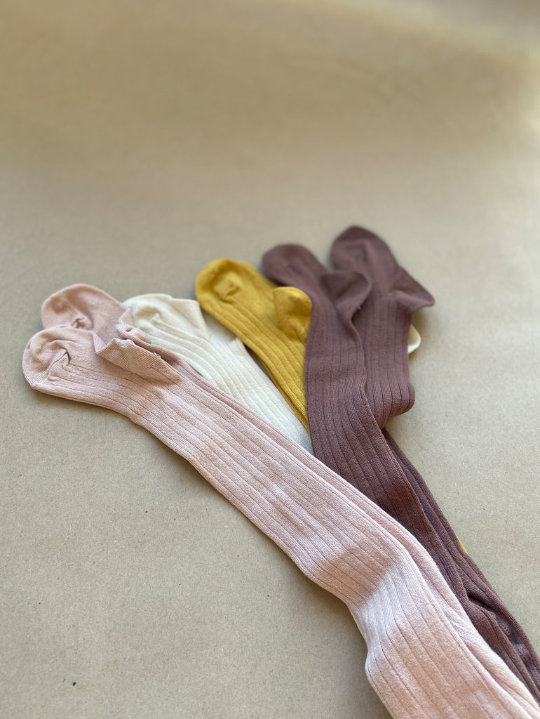 Pink, yellow, dark rose and off white ribbed tights at One We Like