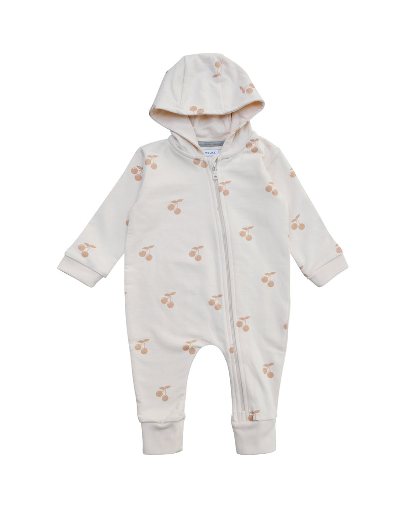 All in one baby suit with zipper in front and lined hood. Wear it on it's on as a relaxed sweatshirt suti or with a body underneath as layer two. Cherry print all over on soft pink. Made of 100% organic cotton in Portugal.