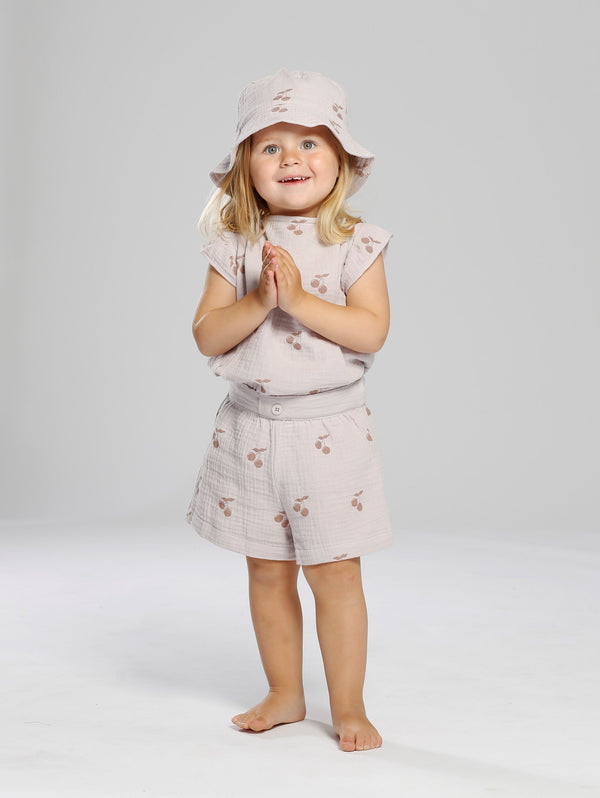 Shorts in muslin cotton fabric with all over cherry print.